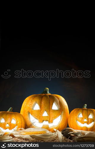 Halloween Pumpkin Burning with copy space. Dark background