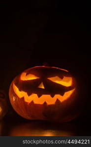 Halloween pumpkin on black. Halloween pumpkin with scary face on black backgound