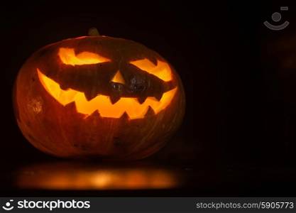 Halloween pumpkin on black. Halloween pumpkin with scary face on black backgound