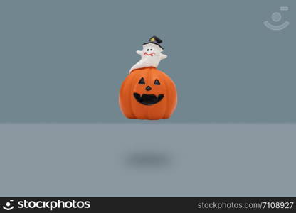 Halloween pumpkin on blue background. Halloween idea concept.