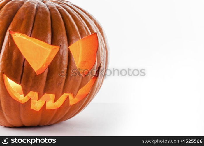 Halloween pumpkin on white. Glowing Halloween pumpkin isolated on white background