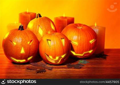 Halloween pumpkin with candles, warm autumn holiday background, traditional jack-o-lantern, night party decoration
