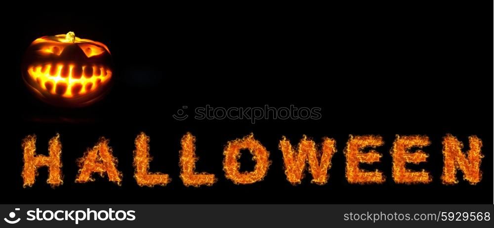 Halloween pumpkin with scary face on black backgound. Halloween pumpkin