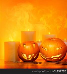 Halloween pumpkins holiday border, with candles and smoke, traditional jack-o-lantern over warm yellow light, night party decoration, fun concept