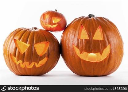 Halloween pumpkins on white. Glowing Halloween pumpkins isolated on white background