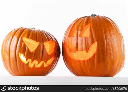 Halloween pumpkins on white. Glowing Halloween pumpkins isolated on white background