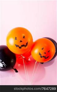 Halloween scene with balloons on pink background. Halloween scene with balloons