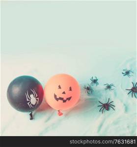Halloween scene with to scary balloons on blue background, retro toned. Halloween scene with balloons