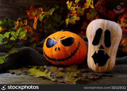 Halloween Stingy Jack pumpkins on dark rustic background. Halloween Stingy Jack pumpkins on dark rustic background. Halloween symbol jack-o-lantern background. Halloween decoration.