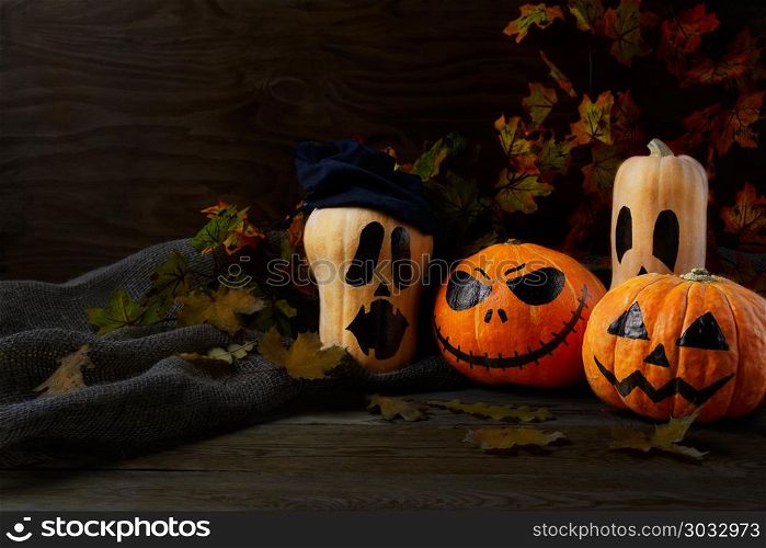Halloween Stingy Jack pumpkins on rustic background, copy space. Halloween Stingy Jack pumpkins on rustic background, copy space. Halloween symbol jack-o-lantern background. Halloween decoration.