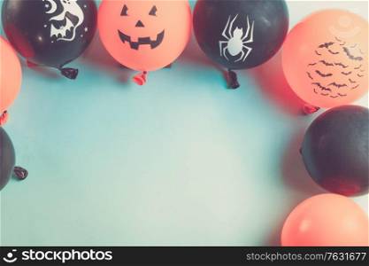 Halloween top view scene with balloons on blue background, retro toned. Halloween scene with balloons