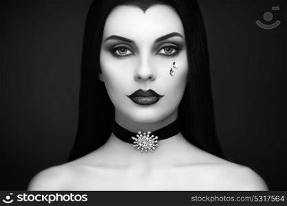 Halloween Vampire Woman portrait. Beautiful Glamour Fashion Sexy Vampire Lady with Long Dark Hair, Beauty Make Up and Costume
