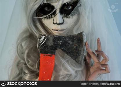 Halloween witch holding axe