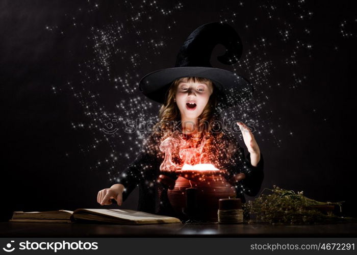 Halloween witch. Little Halloween witch reading conjure above pot