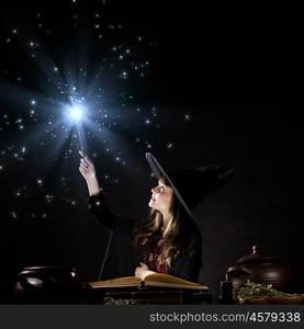 Halloween witch. Little Halloween witch reading conjure from magic book