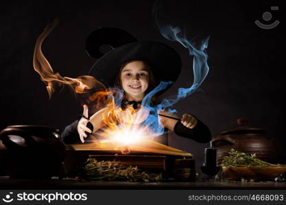 Halloween witch. Little Halloween witch reading conjure from magic book