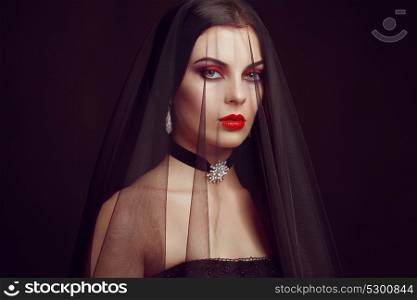 Halloween Woman portrait. Beautiful Glamour Fashion sexy lady with dark Veil, Beauty make up and Costume