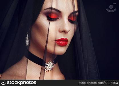 Halloween Woman portrait. Beautiful Glamour Fashion sexy lady with dark Veil, beauty make up and Costume