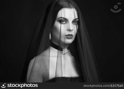 Halloween Woman portrait. Beautiful Glamour Fashion sexy lady with dark Veil, Beauty make up and Costume