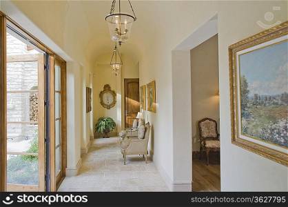 Hallway with furniture and large open doors
