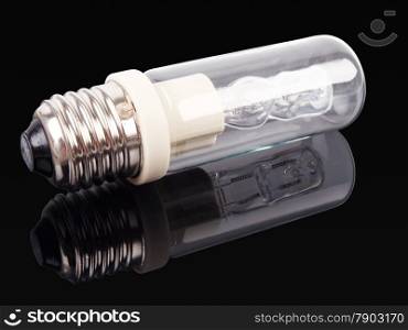 halogen light bulb with reflection on dark background