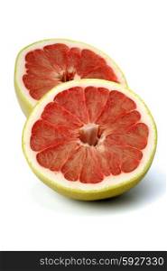 Halved grapefruit on white background