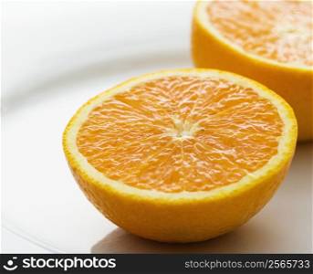 Halved orange against white background.