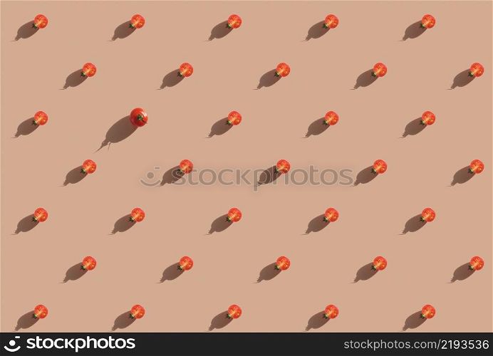 Halves of red cherry tomatoes. Minimal food concept on bright color background. Seamless pattern for poster or advertisement. minimal creative pattern