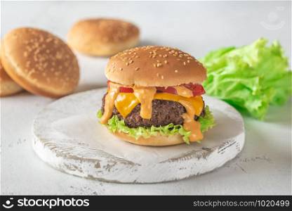 Hamburger on the wooden board close-up