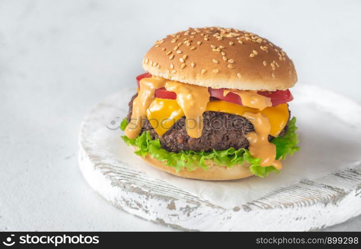 Hamburger on the wooden board close-up