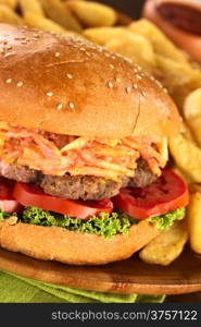 Hamburger with French fries (Selective Focus, Focus on the front of the hamburger)