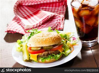 hamburger with glass of cola
