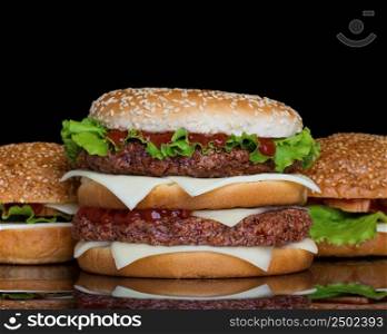 Hamburgers on black background