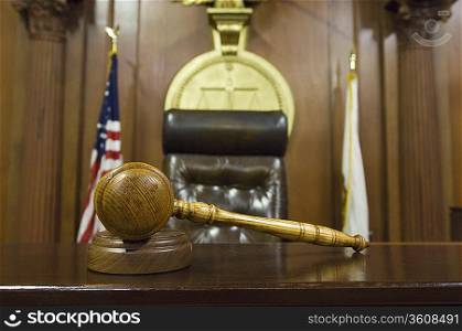 Hammer and gavel near judges chair in court
