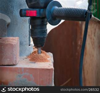 Hammer drill in a brick