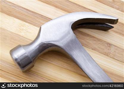 Hammer isolated on wood background