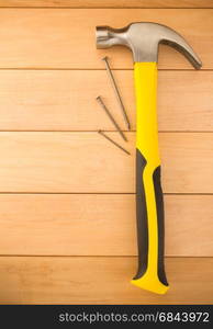 hammer tool on wood. hammer tool on wooden background