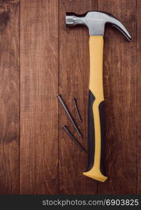 hammer tool on wooden background