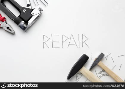 hammers repair word written with nails