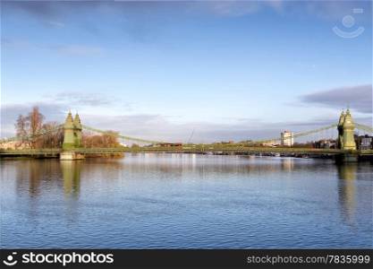 Hammersmith Bridge and south riverside of Thames London