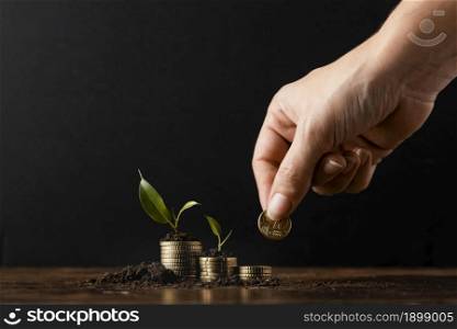 hand adding coins stack covered dirt plants. Resolution and high quality beautiful photo. hand adding coins stack covered dirt plants. High quality beautiful photo concept