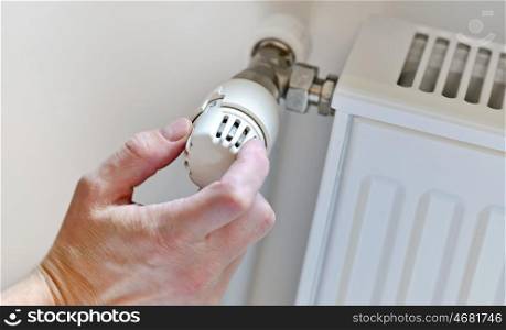 Hand Adjusting Heater Thermostat in winter time