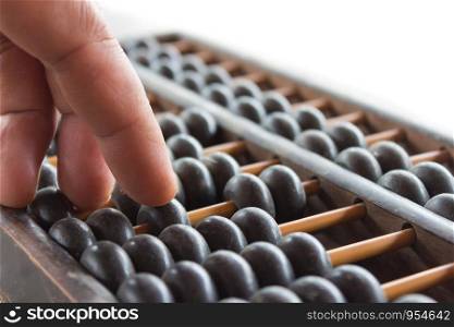 Hand and ABACUS old antique calculator retro finance education ,tool work business accounting