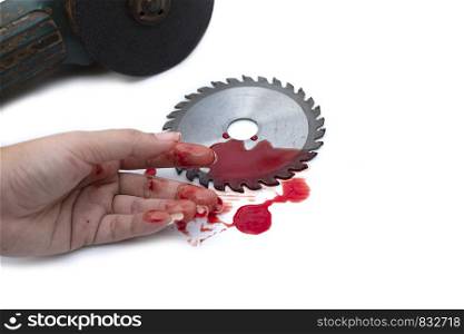 Hand and circular saw disc bloody on white backgrounf, Safety first