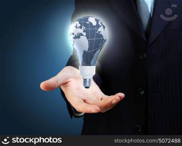 hand and lamp. Hand with lamp and hands of a business person