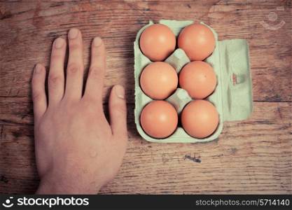 Hand and six eggs