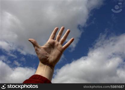 hand and the clouds