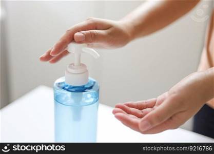 Hand applying Alcohol gel sanitazer liquid cleaning hands for prevent corona virus covid-19