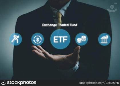 Hand businessman icon ETF Exchange Traded Fund virtual screen Internet Business stock market finance Index Fund Concept.