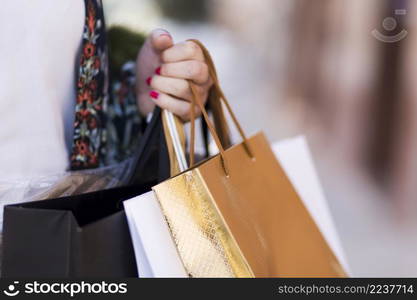 hand carrying paper bags